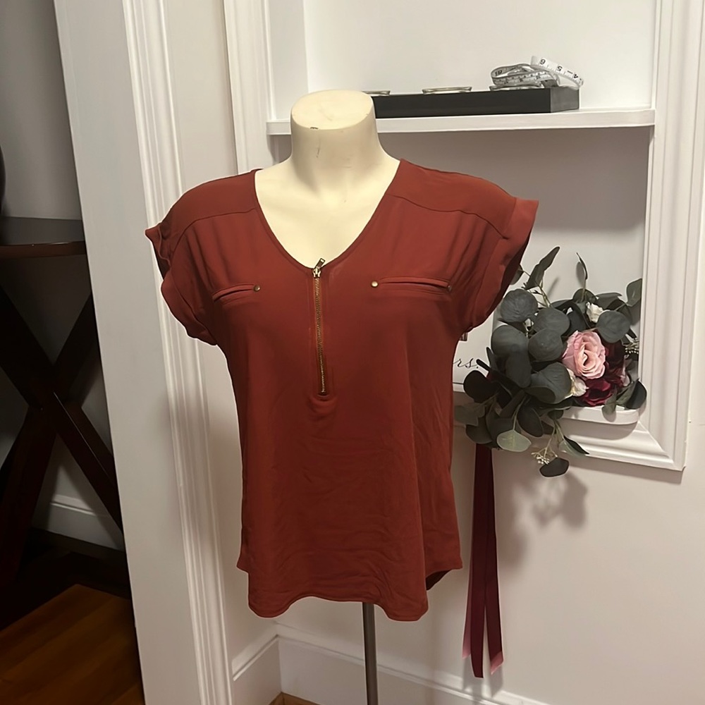 Rust colored size small blouse from sweet wanderer.